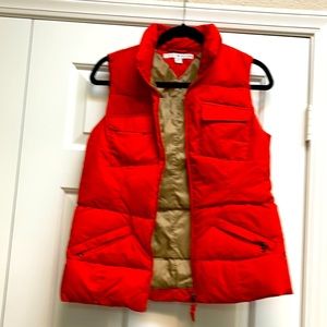 Tommy Hilfiger orange puffer vest size small.